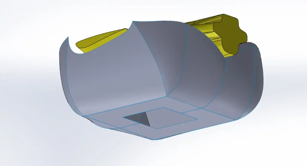CAD model of an airbag with a fan opening on the underside and a component shown in yellow above