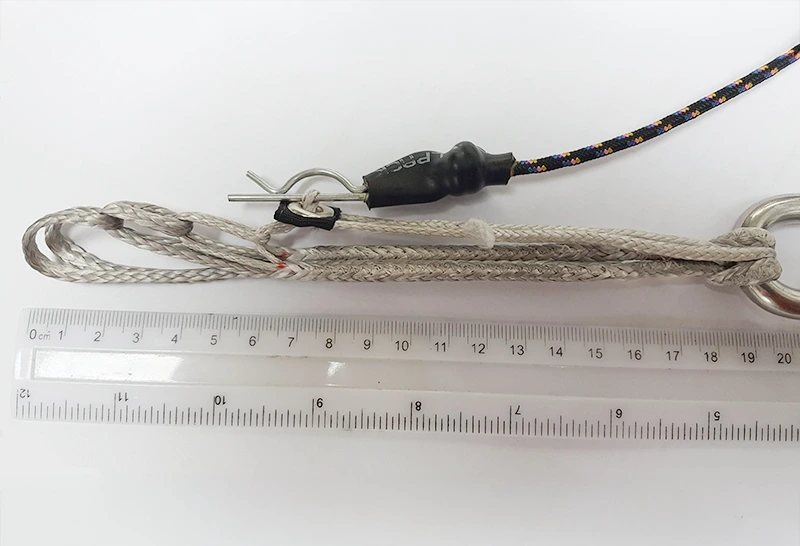 3-ring release with Dyneema loops and metal rings next to a ruler