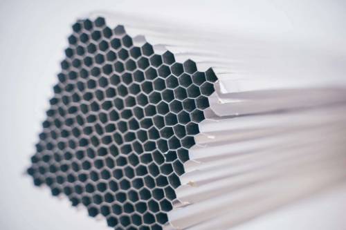 Close-up of a honeycomb block with hexagonal cells used as a shock absorber